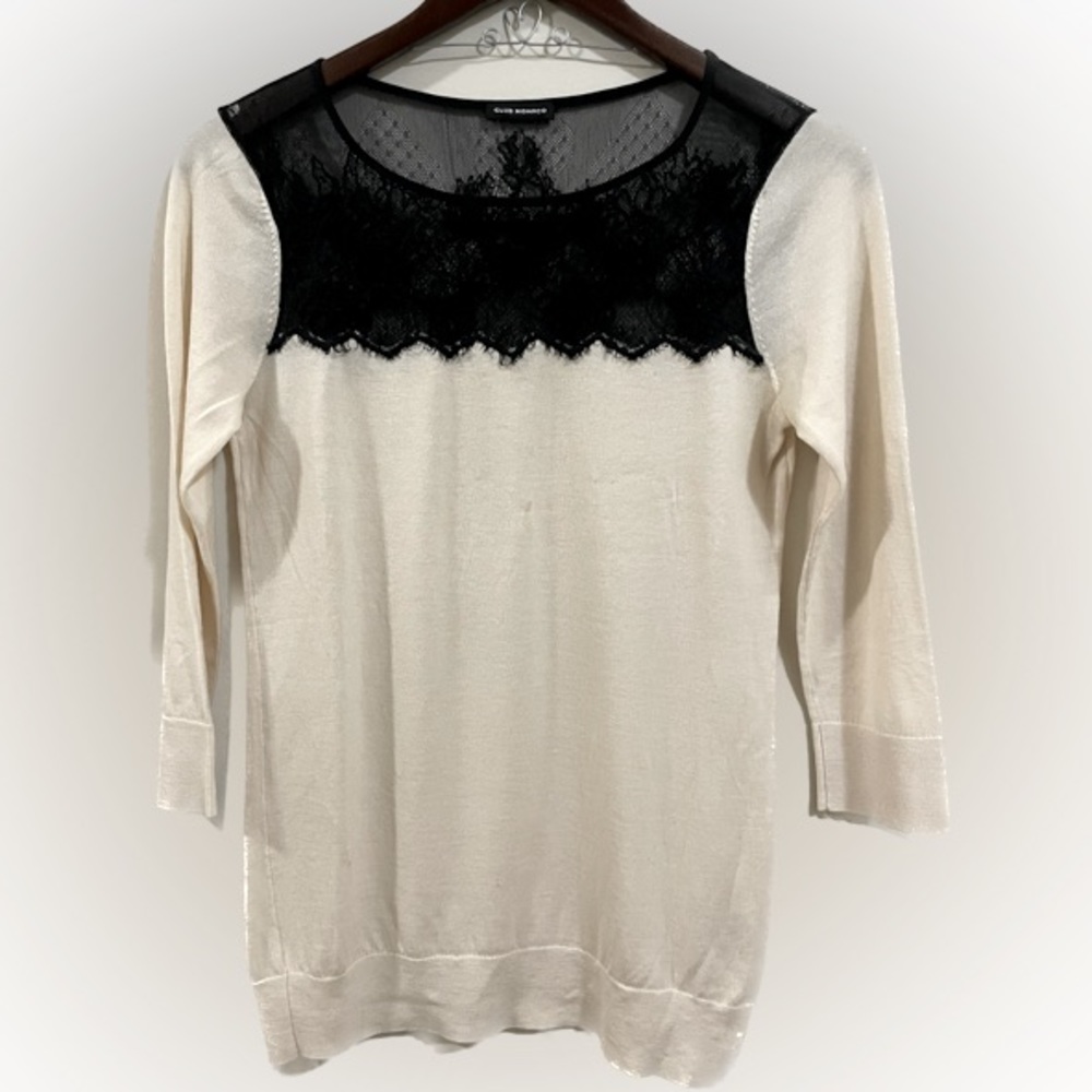 Club Monaco cream sweater with black lace detail at neck